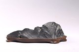 A LINGBI STONE CARVED BRUSHREST WITH WOOD STAND