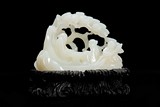 A CHINESE WHITE JADE 'SCHOLARS ON RAFT' CARVING