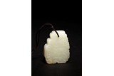 A CHINESE WHITE JADE 'PHOENIX' PENDANT