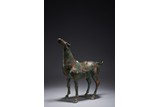 AN ARCHAISTIC BRONZE INSCRIBED HORSE