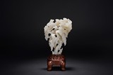 A CHINESE WHITE JADE CARVED SCHOLAR'S ROCK