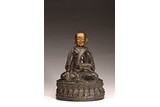 A TIBETAN GILT PAINTED BRONZE SILVER INLAID LAMA 