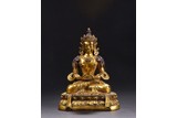 A GILT-BRONZE FIGURE OF AMITAYUS