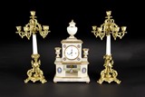 A SET OF VIENNA WHITE MARBLE AND GILT CLOCK SET