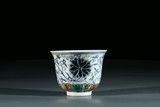 A CHINESE DOUCAI 'FLORAL' WINE CUP