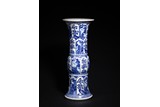 A BLUE AND WHITE 'LANDSCAPE AND FLOWERS' GU VASE