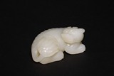 A CHINESE 'MUTTON-FAT' WHITE JADE CARVED MYTHICAL BEAST