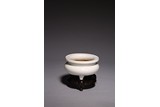A CHINESE WHITE GLAZED TRIPOD CENSER