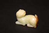 A CHINESE WHITE JADE CARVED DOG 