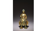 A CHINESE GILT BRONZE FIGURE OF SEATED BUDDHA