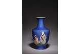A FAMILLE ROSE 'FIGURES' BLUE GROUND VASE