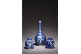 A BLUE AND WHITE REVERSE VASE AND TWO JARS