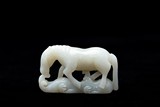 A CHINESE WHITE JADE CARVING OF HORSE