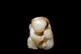 A WHITE AND RUSSET JADE CARVING OF BOY AND CAT