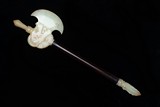 A CELADON JADE MYTHICAL BEAST HEAD AXE