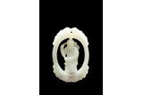 A WHITE JADE PLAQUE WITH REVOLVING 'FIGURE' CENTER