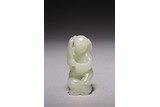 A CHINESE WHITE JADE BOY CARVING
