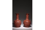 A PAIR OF CINNABAR LACQUER FIGURES BOTTLE VASES