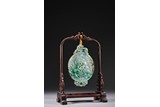 A CHINESE JADEITE CARVED HANGING BI DISC 