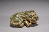 A GILT BRONZE WEIGHT OF MYTHICAL BEAST
