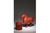 A CHINESE CINNABAR LACQUER HORSE AND BOX 