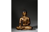A LARGE GILT BRONZE FIGURE OF SHAKYAMUNI