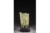A LARGE CHINESE CELADON JADE 'LEAF' VESSEL