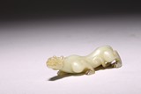 A CHINESE WHITE JADE MYTHICAL BEAST