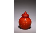 A RED BEIJING GLASS JAR AND COVER