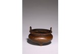 A CHINESE BRONZE TRIPOD CENSER