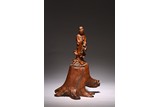 A BOXWOOD CARVED GUANYIN FIGURE