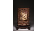 A CARVED QIYANG 'RIVERSCAPE AND PAVILION' TABLE SCREEN