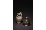 A GROUP OF TWO BROWN GLAZED JARS