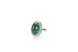 A GREEN JADEITE CABOCHON AND DIAMOND RING 