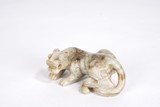 AN OPAQUE WHITE JADE TIGER CARVING
