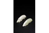 A PAIR OF CHINESE CALCIFIED CELADON JADE PIGS