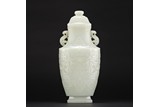 A MAGNIFICENT WHITE JADE 'TAOTIE' VASE AND COVER