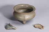 A CHINESE GUAN TRIPOD CENSER AND TWO PORCELAIN FRAGMENTS
