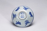 A RARE CHINESE BLUE AND WHITE 'FLORAL AND LION' BOWL