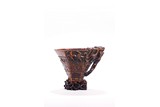 A CHINESE AGARWOOD CARVED 'CHILONG' LIBATION CUP