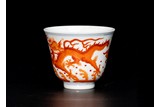 AN IRON RED ENAMELED 'DRAGON' CUP