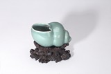 A CHINESE CELADON GLAZED 'CONCH SHELL' WASHER