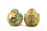 A PAIR OF YELLOW GLAZE LOTUS POND JARS AND COVERS