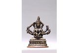 A COPPER ALLOY FIGURE OF 