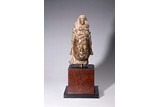 A CHINESE LIMESTONE CARVED 'GUANYIN' HEAD WITH STAND