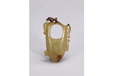 A YELLOW JADE ARCHAISTIC ORNAMENT