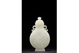 A WHITE JADE 'MAGPIE AND PLUM BLOSSOM' VASE