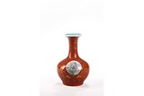 A GILT PAINTED CORAL RED GROUND BOTTLE VASE