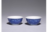 A PAIR OF REVERSE DECORATED BLUE AND WHITE DRAGON CUPS