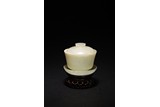 A CHINESE WHITE JADE BOWL AND STAND